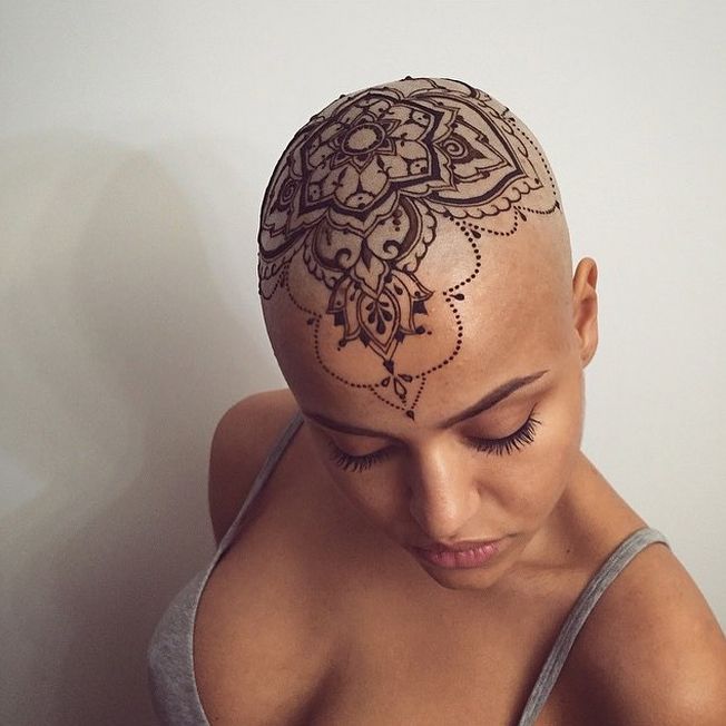 a woman with a tattoo on her head