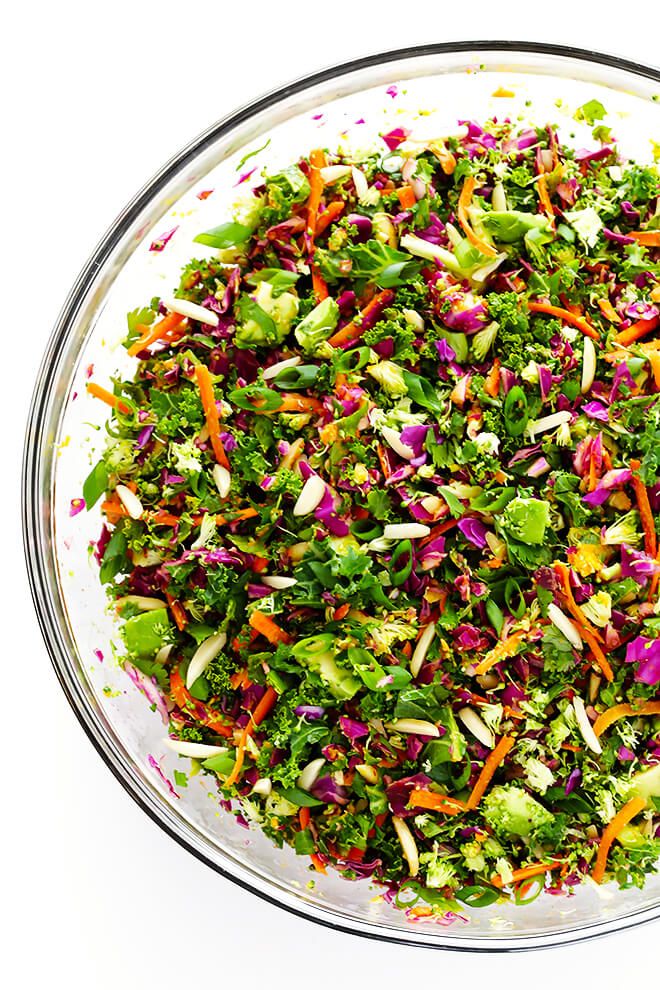 a bowl filled with lots of veggies on top of a table