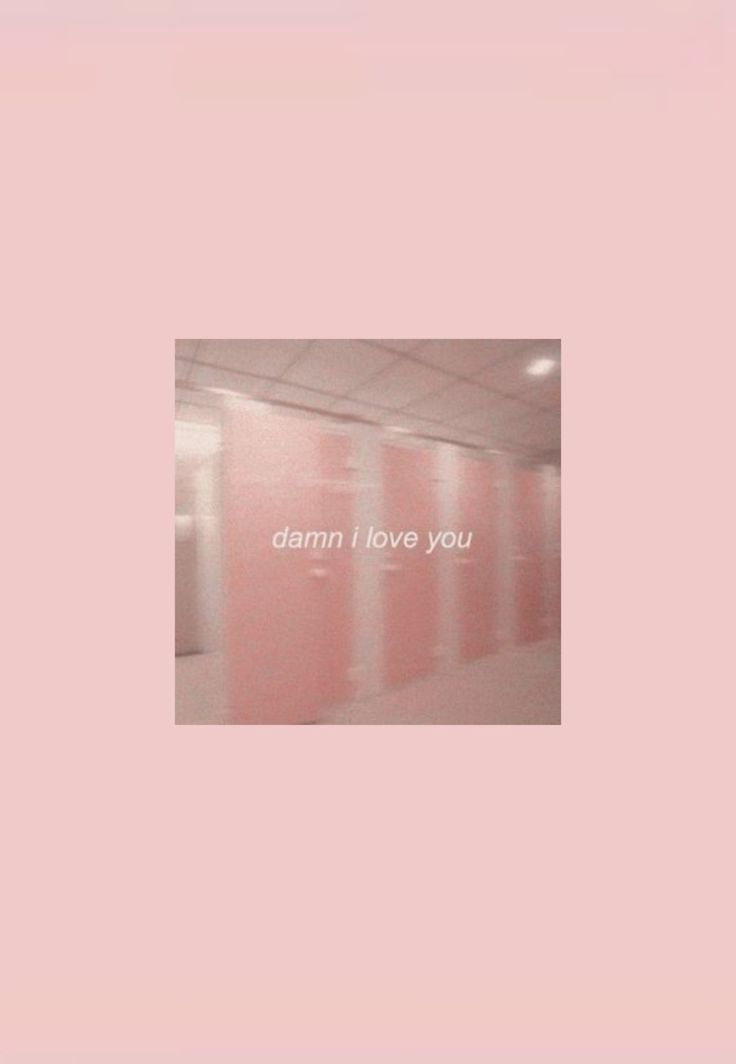 an empty room with pink walls and the words damn i love you