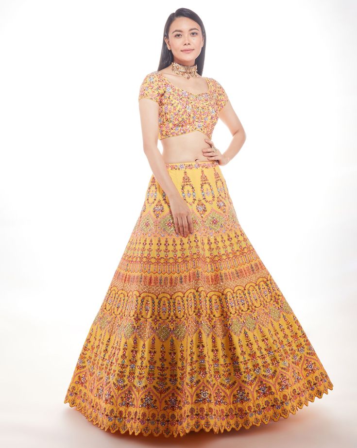 A yellow silk lehenga with fine multi-hued resham embroidery with a touch of sequins and glass beads paired with a matching blouse and mauve pink net dupatta From Chamee and Palak 's The Wedding Edit collectionDELIVERY TIMEPlease allow 8-12 weeks for your outfit to arrive.FABRIC DETAILSSilk And NetProfessional cleaning only. Yellow Silk Traditional Wear With Intricate Embroidery, Yellow Silk Sets For Reception, Yellow Embroidered Chanderi Lehenga, Yellow Silk Lehenga With Intricate Embroidery, Yellow Silk Choli With Resham Embroidery, Yellow Semi-stitched Sharara For Reception, Designer Yellow Choli For Navratri, Yellow Silk Set With Intricate Embroidery, Yellow Raw Silk Dress With Intricate Embroidery