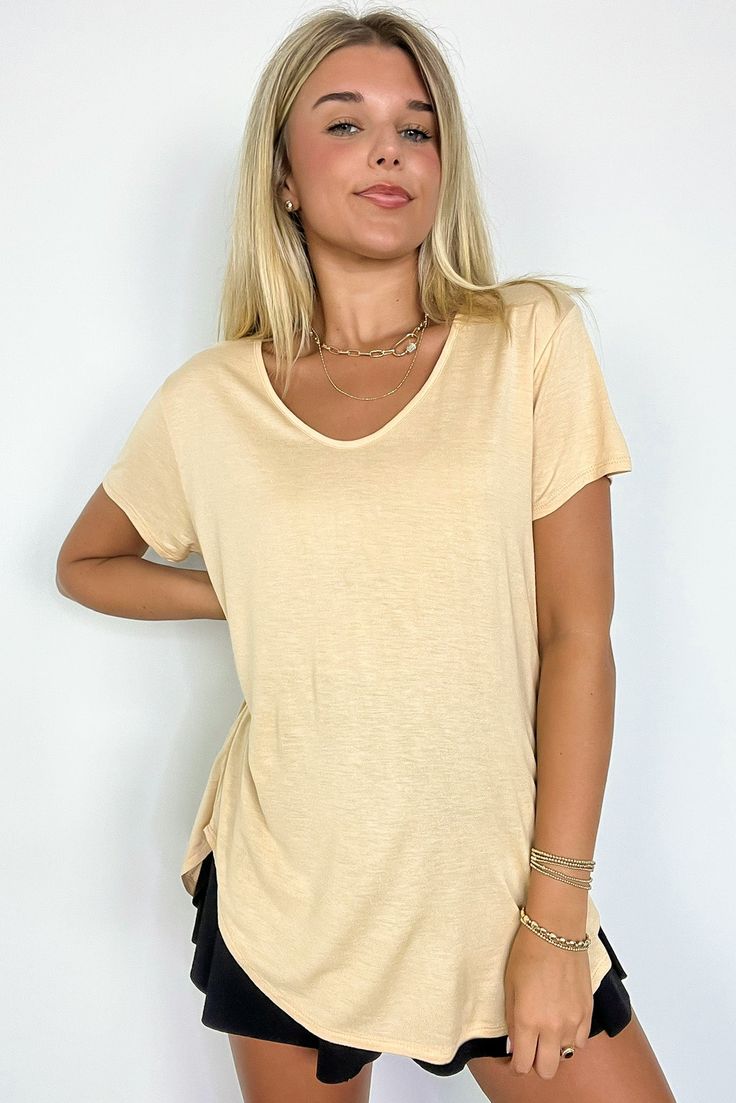 Details: This top is a must in every wardrobe. It features a super soft fabric and a V-neck with a soft angle. Wear it with your favorite Mono B active pieces for an athleisure look, with a denim jacket for an on the go look, or even with a blazer and accessories for a quick, glam look. - Short sleeves - Cutout detail Content: 100% Rayon Size + Fit- Model is 5'8" and wearing a Small- Measurements from a size small- Full length: 30"- Chest: 44"- Waist: 42"- Sleeves: 7" Versatile Beige V-neck Top, Beige Solid Color V-neck Top, Comfortable Relaxed Fit V-neck Top, Comfortable V-neck Relaxed Fit Tops, Versatile V-neck T-shirt For Loungewear, Comfortable V-neck Tops For Spring, Comfortable V-neck Top For Layering, Solid V-neck Athleisure Top, Casual V-neck Top For Layering With Relaxed Fit