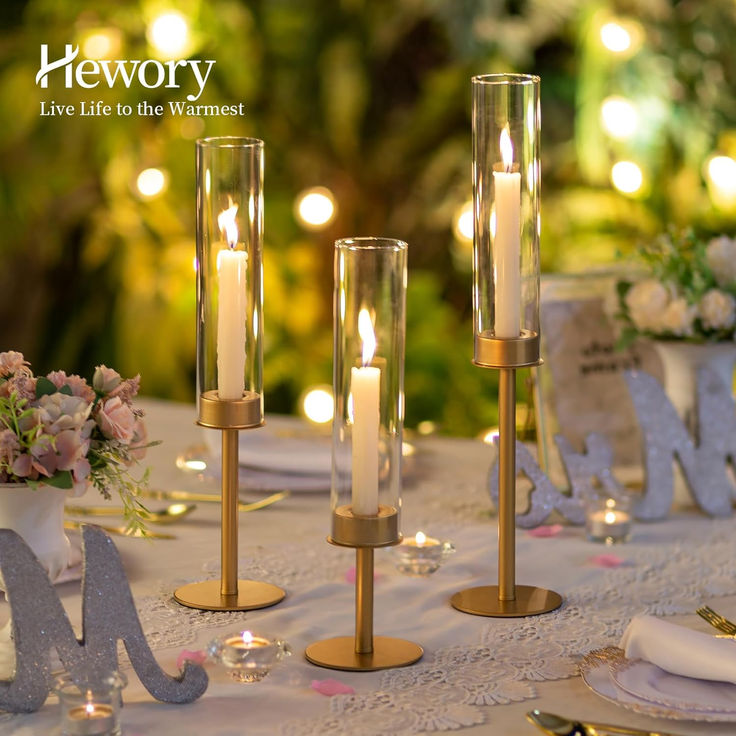 a table with candles and flowers on it