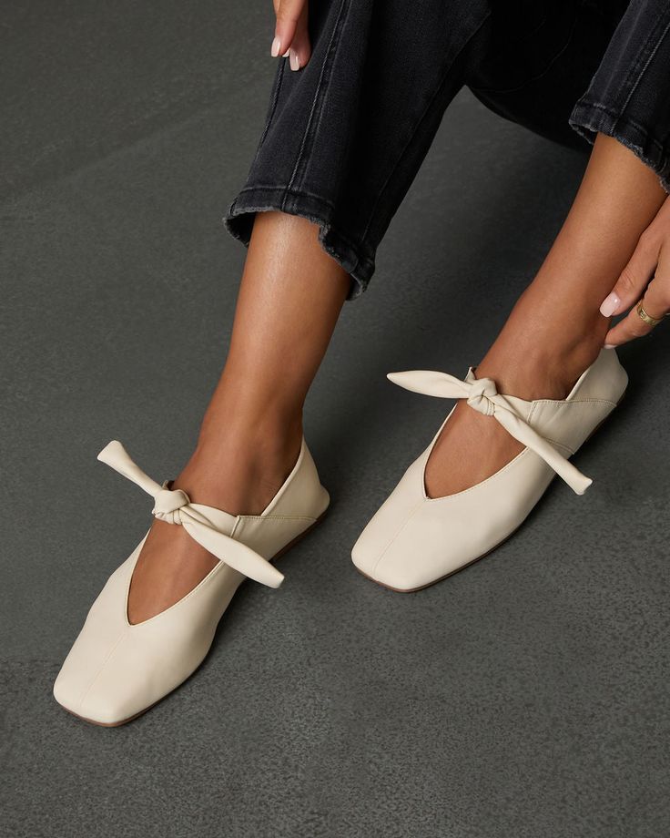 Step into romance with the Take My Hand Knotted Ballet Flats. Crafted from smooth faux leather, these beauties exude effortless French charm with the dainty knotted detail at the vamp that adds a touch of feminine flair, making them the perfect pairing for both casual dates and chic outings. Whether you’re strolling through autumn streets or enjoying a cozy café moment, these flats offer a blend of sophistication and comfort that will have you falling in love all season long. Smooth faux leather Adjustable knot tie accent at vamp Square toe Runs small, consider sizing up Material: Faux leather Square Toe Flats, Take My Hand, Knot Tie, Adjustable Knot, Swimwear Bottoms, Casual Date, Shopping Day, Heeled Loafers, Long Sweaters