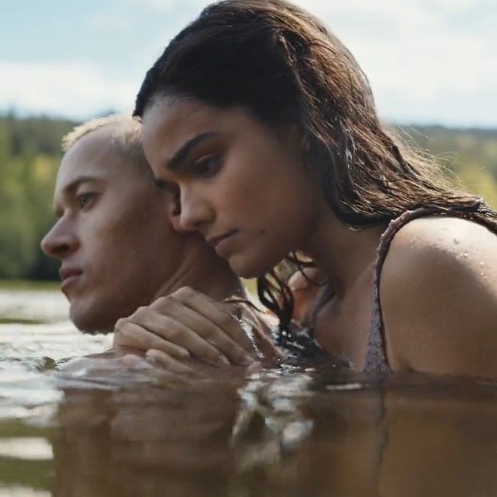 a man and woman are in the water