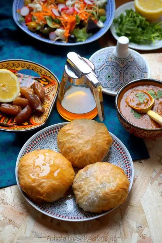 a table topped with plates and bowls filled with food