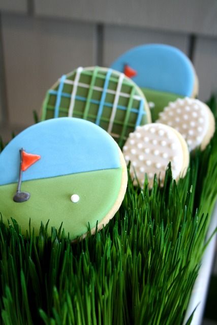 some cookies in the grass with golf balls on them