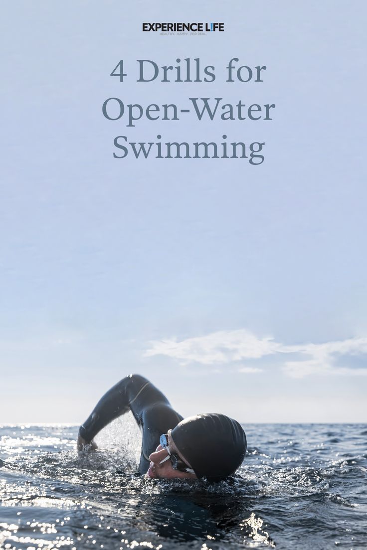 a person swimming in the ocean with text reading 4 drills for open - water swimming