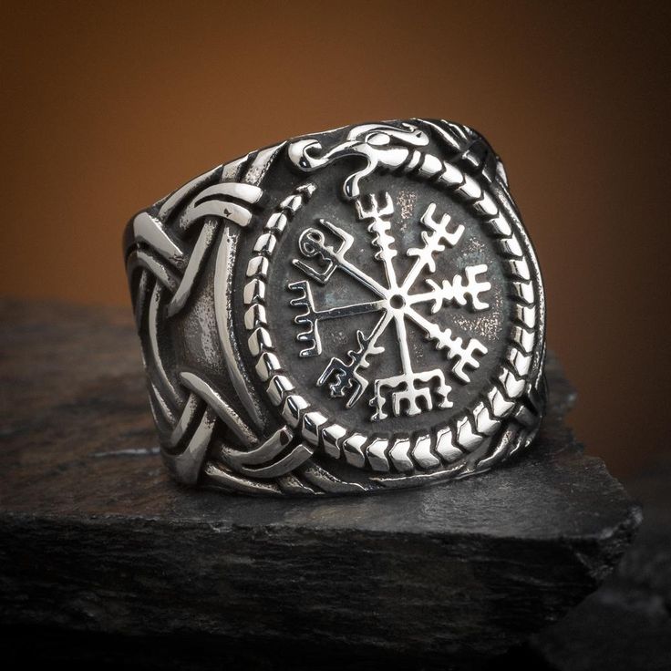 Substantial chunky stainless steel ring featuring a central Vegvisir surrounded by a Jormungand serpent. Available in US sizes 9-13 Durable Symbolic Jewelry As A Gift, Symbolic Jewelry As A Gift, Durable Viking Style Jewelry Gift, Handmade Viking Style Jewelry For Outdoor, Viking Style Silver Outdoor Jewelry, Viking Style Engraved Ring As Gift, Viking Jewelry Women Norse Spirit, Luxury Silver Viking Style Jewelry, Norse Pagan Jewelry