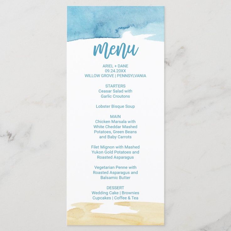 a menu card with watercolor blue and yellow colors on the front, sitting on top of a marble surface