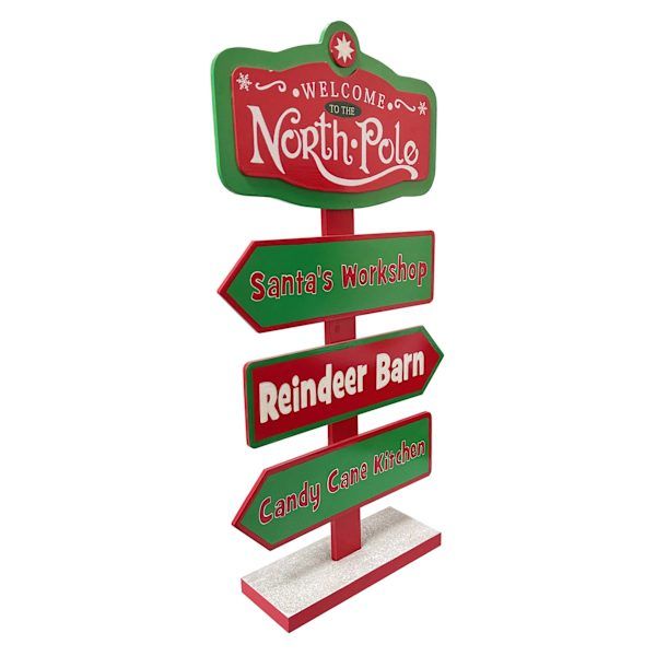 a red and green sign that says welcome to north pole