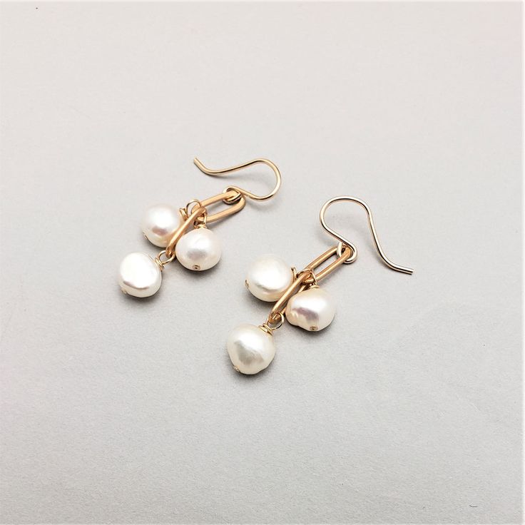 Three stones dangle from brass chain.  Great for all ages, these simple earrings are easily dressed up or down.     All pieces will be packaged together in a cotton filled jewelry box unless otherwise specified. Please let us know if your order is a gift and we will gladly include a handwritten note and complimentary g Dainty Metal Drop Pearl Earrings, Handmade White Pearl Earrings In 14k Gold Filled, White Gold Plated Dangle Jewelry, Handmade White Gold-plated Earrings, Delicate Brass Jewelry For Gifts, Hypoallergenic Metal Wedding Earrings, Hypoallergenic Metal Earrings For Wedding, Classic Metal Jewelry With Pearl Drop, Handmade Dangle Pearl Earrings In 14k Gold Filled