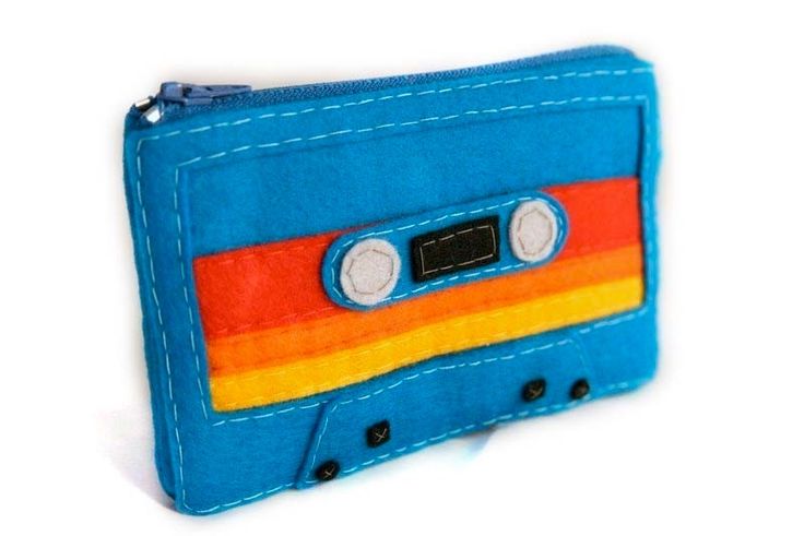 a small blue wallet with an orange and red cassette tape on it's side