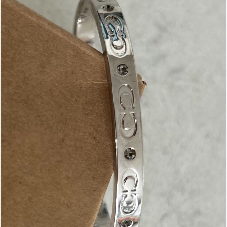 Questions? Leave A Comment Below! Coach Adjustable Bangle, Adjustable Coach Bangle, Luxury Adjustable Coach Jewelry, Coach Metal Bangle Jewelry, Coach Metal Bracelet Jewelry, Elegant Coach Bangle Jewelry, Luxury Adjustable Bracelet By Coach, Luxury Adjustable Coach Bracelets, Luxury Adjustable Coach Bracelet