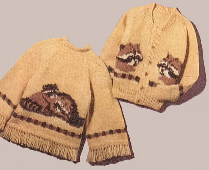 two knitted sweaters with animals on them, one is yellow and the other is brown