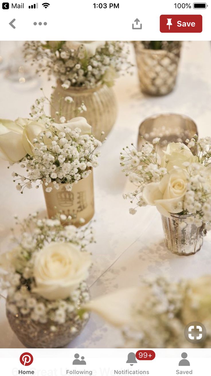 flowers in vases sitting on top of a white table cloth covered table with an instagram page