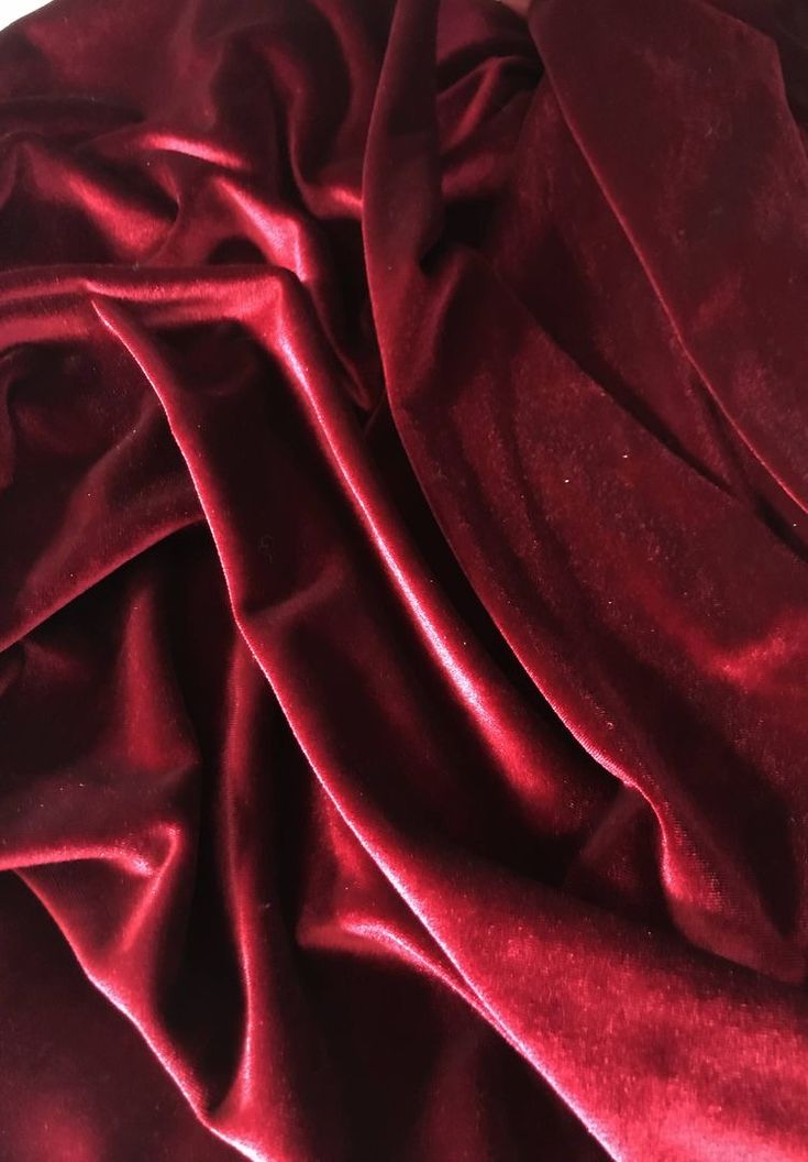 a close up view of a red velvet fabric