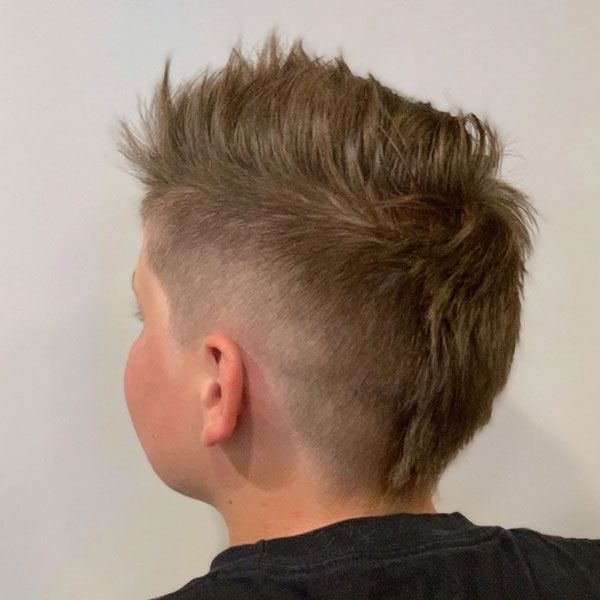 Little Boy Mohawk Fade #fade #boysfade #boysshorthair #boyshair #cutekids #littleboys #boyshairstyles #boyshaircuts #kidshaircuts Little Boy Mowhawk Haircuts, Boy Mow Hawk, Euro Mullet Kids, Toddler Boy Faux Hawk, Patrick Mahomes Haircut For Boys, Baseball Mullet Haircut Boys, Boys Fohawk Haircut Kids, Eurohawk Boys Haircut, Fauxhawk Fade Boys