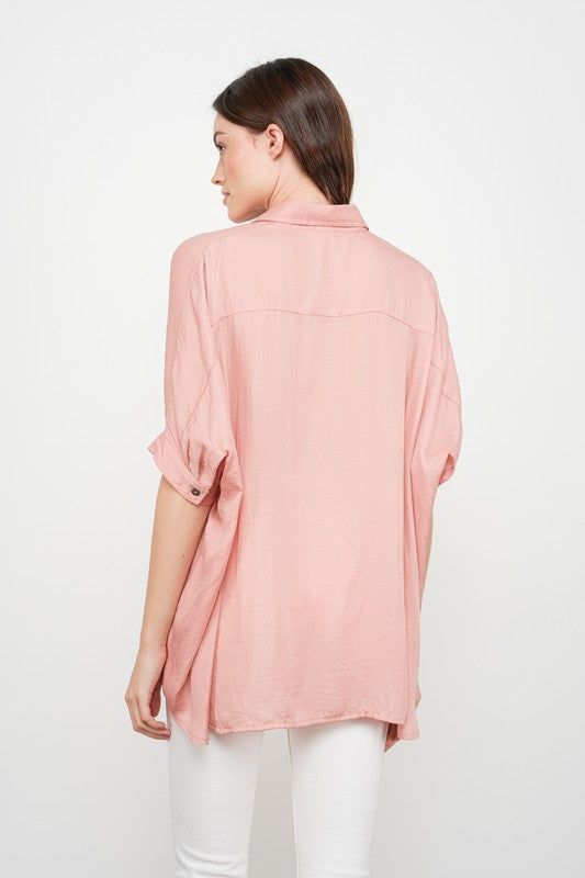 Satin button down dolman sleeve top Oversized fit 100% Polyester Rayon Button-up Top With Buttons, Oversized V-neck Blouse With Button Closure, Oversized Solid Color Blouse With Shirttail Hem, Spring Tops With Rolled Sleeves, Relaxed Fit Rayon Button-up Tops, Spring Button-up Top, Versatile Batwing Sleeve Workwear Tops, Oversized Rayon Summer Blouse, Blouse With Rolled Sleeves For Daywear