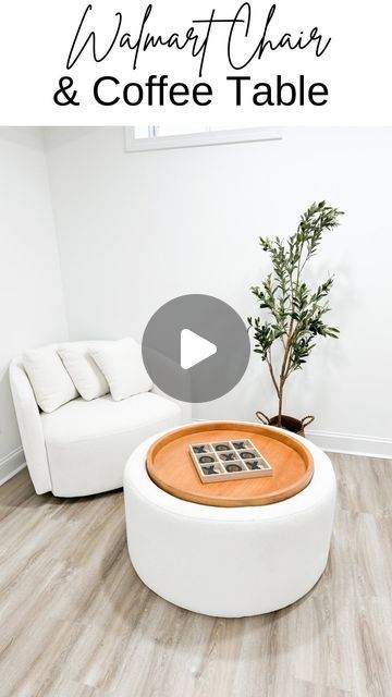 a living room with white couches and coffee table in front of the tv screen