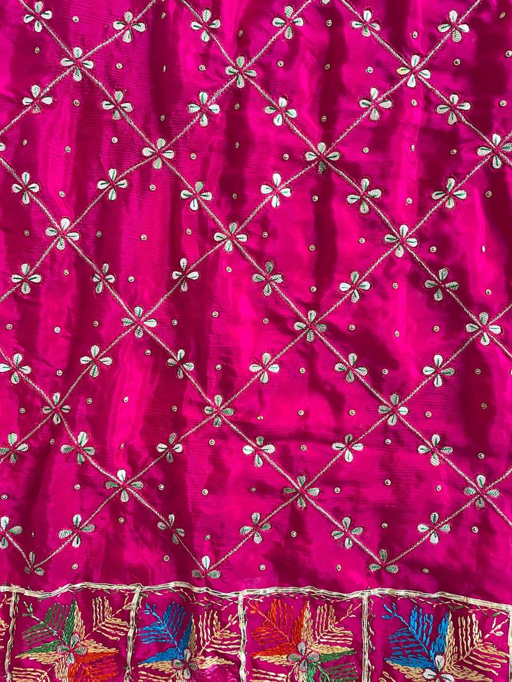 This elegant traditional Rani Pink Phulkari Dupatta is expertly crafted from Pure Chinon Silk, with Gotta Patti and phulkari hand embroidery all over. The perfect choice for weddings, sangeet, jaago, and chunni ceremonies. Material: Pure silk chinon Work: Silk thread phulkari handwork, all over gotta patti work Pattern: Floral Size: Full Size 2.5 meters Dispatched in 1-3 business days Product Note:​ This is a handcrafted product from artisans and producer groups and due to the nature of the prod Phulkari Pants, Gotta Patti Work, Patiala Salwar Suits, Bridal Dupatta, Rani Pink, Phulkari Dupatta, Gotta Patti, Work Pattern, Party Wear Lehenga