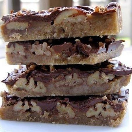 three pieces of chocolate and walnut bars stacked on top of each other