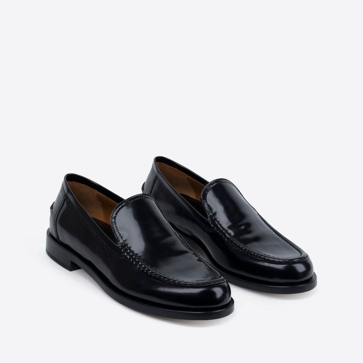 In rich, black Spazzolato leather, our College Loafer is bridging tradition and trend. Elegant, breathable, with padded insoles and a classic round toe. Pairs well with a mini skirt and a Harvard degree. Classic Patent Leather Slip-on Loafers, Classic Calf Leather Slip-ons For Office, Sleek Patent Leather Loafers With Leather Sole, Classic Black Slip-ons With Stitched Sole, Timeless Black Slip-on Loafers, Classic Black Slip-ons With Brogue Detailing, Sleek Calf Leather Loafers With Leather Sole, Luxury Slip-on Dress Shoes For Business Casual, Black Calf Leather Loafers With Stitched Sole