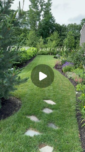 a garden with green grass and stepping stones