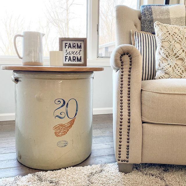 a chair and ottoman in front of a window with the number 30 on it's side