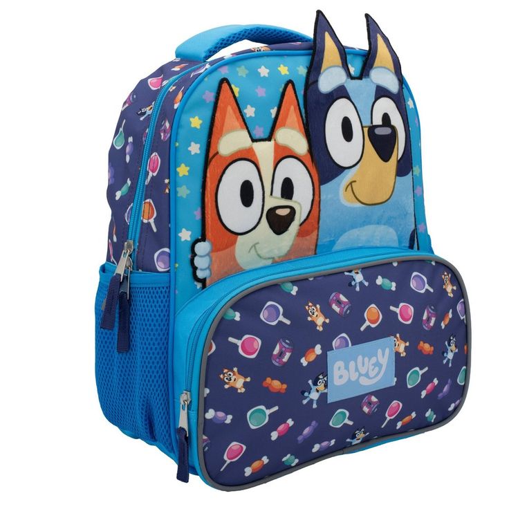 Your kiddo will love this Candy Jam Bluey Backpack! Let them flaunt this bag around EVERYWHERE and ANYWHERE. The backpack features a Bluey and Bingo plush applique, all over bluey print on the front, side, back straps and even on the interior pocket! This 14" kids backpack is designed with a spacious main zippered compartment with a separate padded laptop sleeve for storing their books, laptop/tablet, lunch, supplies or other essentials. It also features an exterior zip pocket in front for safe Cute Blue Backpack For Back To School, School Bags With Cartoon Print For Back To School, Playful School Bag With Character Print, Blue Cartoon Bags For Back To School, Blue Cartoon Backpack For Everyday Use, Back To School Bags With Character Print, Fun Blue School Bag, Fun Blue School Backpack, Blue Cartoon Backpack Bag