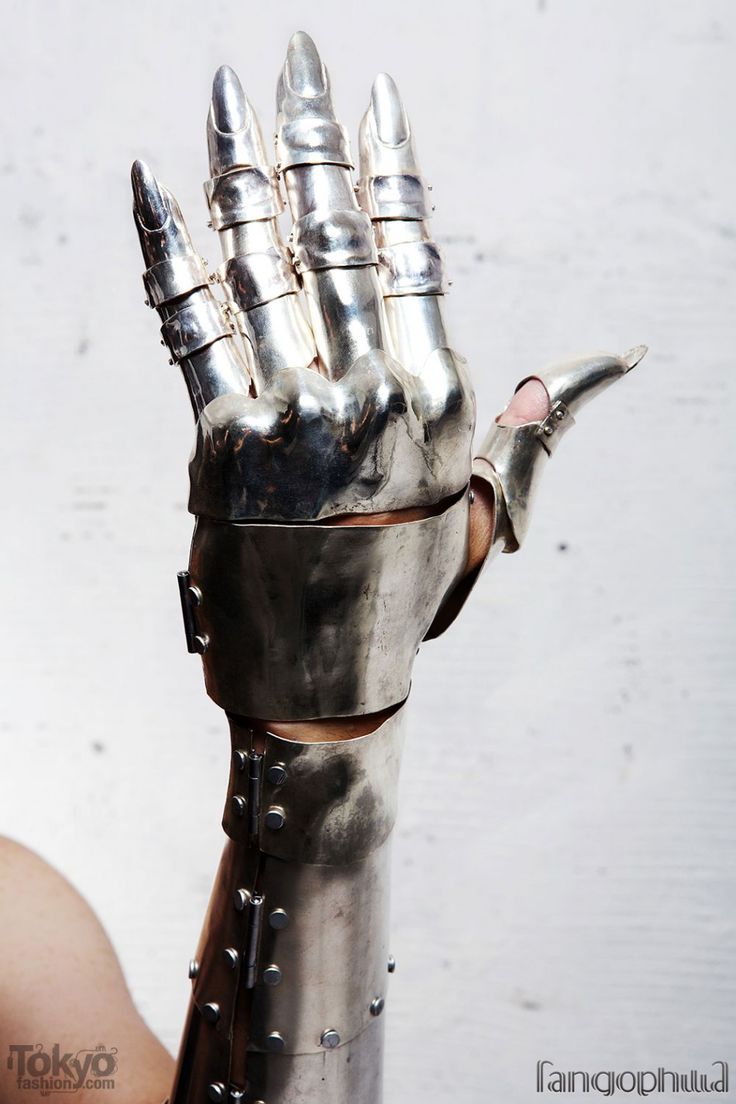 a close up of a metal hand with spikes on it