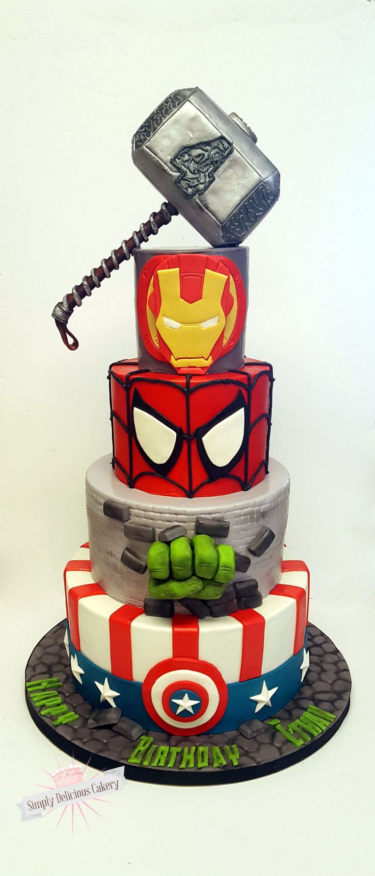 a three tiered cake with an iron man phone on top