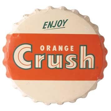 an orange crush soda bottle cap with the word enjoy on it's front side