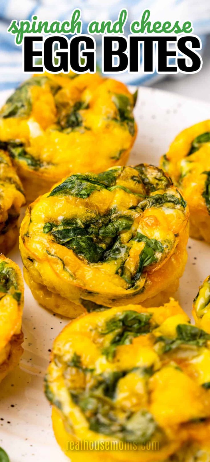 spinach and cheese egg bites on a plate with text overlay that reads spinach and cheese egg bites