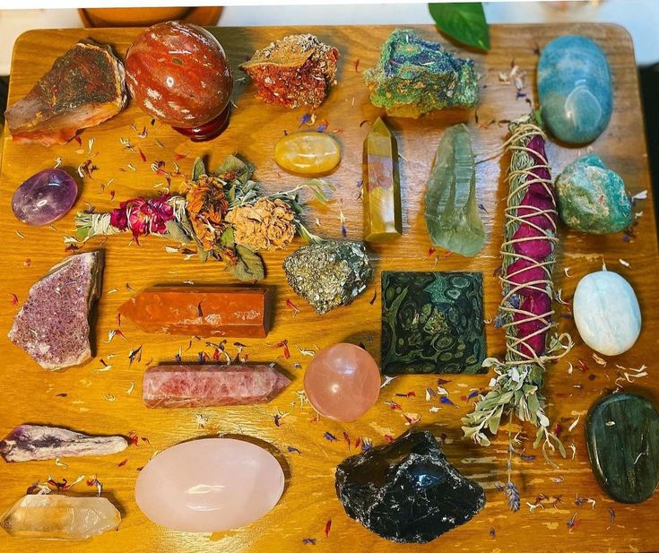 a wooden table topped with lots of different types of rocks