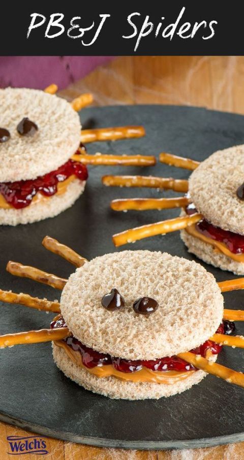 some kind of sandwich that is made to look like a spider with cheese and ketchup on it