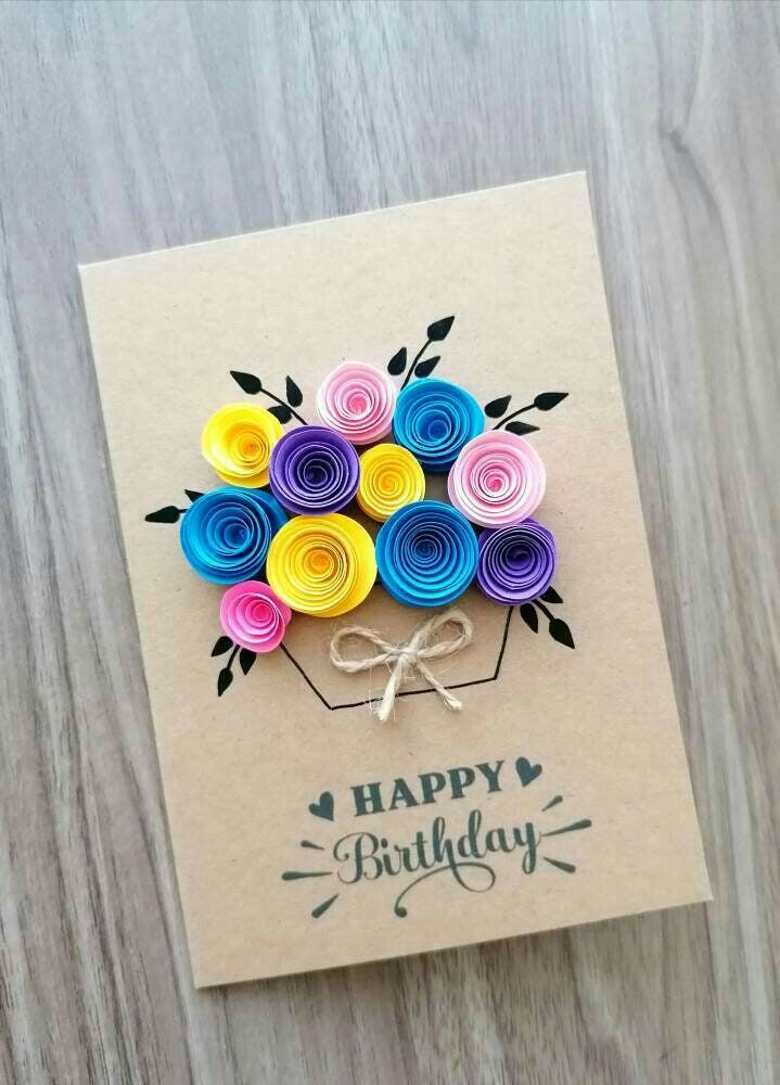 a birthday card with colorful paper flowers on it