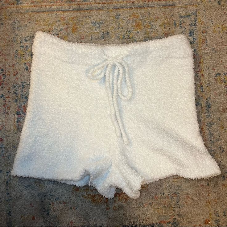 So Cute For A Slumber Party Or Bridal Pajamas! These Are Very Fun Fuzzy White Pajama Shorts With A Fuzzy Drawstring. They’re High Rise Bootie Shorts And Are So Soft!! Waist: 13in Hips: 15.5in Rise: 11in Inseam: 2.5in White Soft Sleepwear For Lounging, White Soft Textured Sleepwear For Lounging, White Soft Texture Sleepwear For Lounging, White Soft Textured Bottoms For Lounging, Cozy White Bottoms For Relaxation, Cozy Pajama Shorts For Pajama Party, Comfy White Shorts For Loungewear, Fitted Pajama Shorts For Bedtime, White Cozy Pajama Shorts For Loungewear