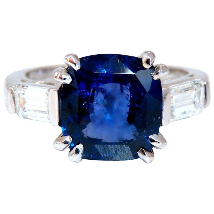 GIA Certified 4.44ct. Natural "Color Change" Blue Sapphire GIA Certified Report ID: 1186699377 9.74 X 9.12 X 5.25mm Cushion cut Clean Clarity & Transparent Transparent, Violet Blue Color .80ct. Natural Baguette Diamonds. G-color Vs-2 clarity. 18kt. white gold 6.3 grams Ring Current size: 6.25 (Free Resize Service, Please inquire) Depth: 8.1mm $40,000 Appraisal Certificate to accompany Gia Certified Blue Sapphire Ring In Platinum, Gia Certified Blue Diamond Gemstones, Luxury Blue Sapphire Ring Gia Certified, Blue Gia Certified Diamond Ring For Formal Occasions, Gia Certified Blue Gemstones For Formal Occasions, Luxury Gia Certified Blue Sapphire Ring, Luxury Gia-certified Blue Sapphire Ring, Blue Brilliant Cut Gemstones For Formal Occasions, Classic Blue Asscher Cut Sapphire Ring