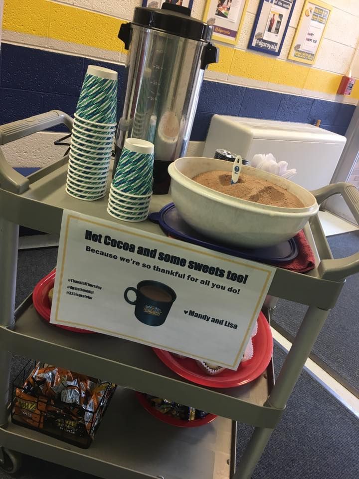 a cart with plates and cups on it