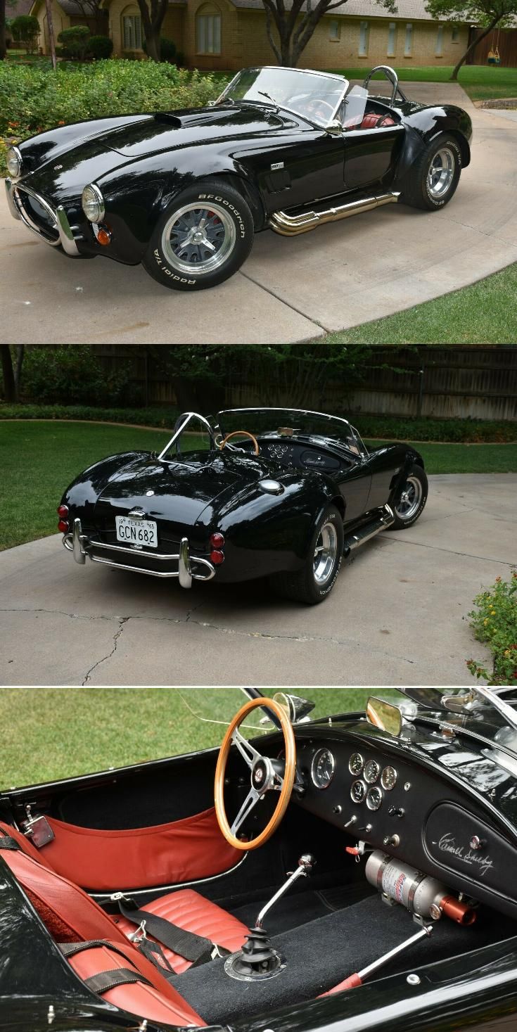 an old black sports car with red leather seats and steering wheel in front of a house