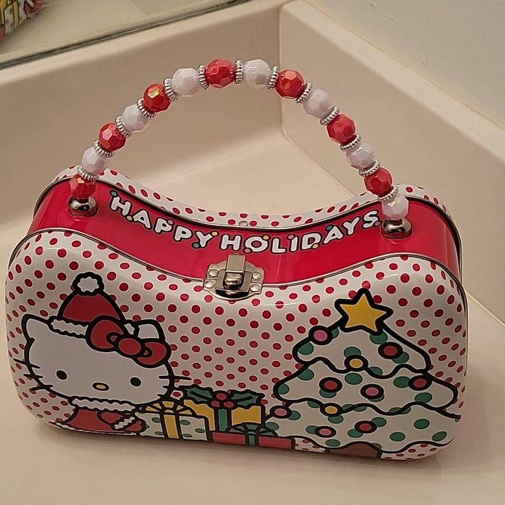 Hello Kitty Happy Holidays Tin Purse With Beaded Handle Opens With A Lunchbox Type Latch. Brand New With Tags Stickers On The Bottom. Those Are The Only Tags That It Came With. Rectangular Hello Kitty Print Bag Gift, Rectangular Hello Kitty Print Bag As Gift, Rectangular Hello Kitty Print Bags As Gifts, Rectangular Hello Kitty Print Bag, Playful Hello Kitty Bag For Gift, Playful Hello Kitty Bag As A Gift, Playful Hello Kitty Bag As Gift, Red Hello Kitty Print Bag For Gift, Red Hello Kitty Print Bag As Gift