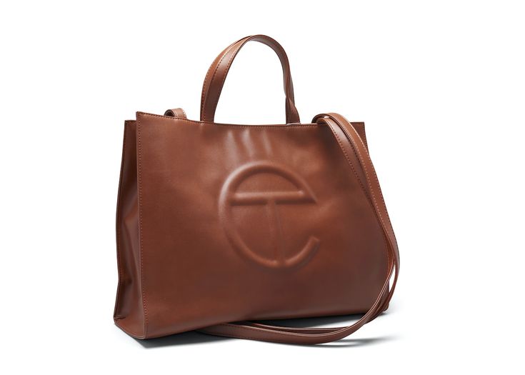 Buy and sell StockX Verified handbags on StockX including the Telfar Shopping Bag Medium Tan and thousands of other handbags with resale price data. Ugg And Telfar Tote Bag, Grey Telfar X Ugg Bag, Telfar Handbag, Telfar Shopping Bag, Telfar Bag, Harrods London, Authentic Bags, Galeries Lafayette, Be Aware