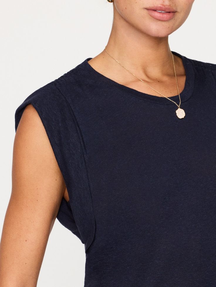 Runs true to size Scoop, crewneck Muscle tee sleeves with double turnback armholes Gusset armholes – bra friendly Elasticized, ruched shoulders Subtle shirttail hem Signature center back seam 25” based on a size small 55% linen, 45% viscose Imported In a new navy hue, our favorite Reins Tee combines our sensual sensibility with sporty details. In a muscle tee silhouette that features double turnback armholes and elasticized, ruched shoulders there is a play on the masculine and feminine. Further Versatile Crew Neck Muscle Tee For Everyday, Relaxed Fit Muscle Tee For Layering, Versatile Crew Neck Tank Top With Relaxed Fit, Effortless Scoop Neck Everyday Tops, Effortless Everyday Scoop Neck Tops, Versatile Crew Neck Tank Top, Versatile Everyday Crew Neck Tank Top, Athleisure Tops With Scoop Back For Everyday, Athleisure Scoop Neck Top For Layering