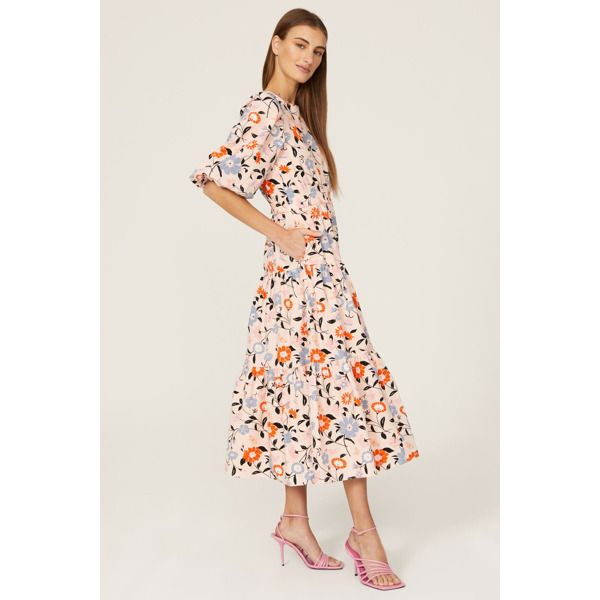 Blush floral cotton (100% Cotton). A-line. Crew neck. Short sleeves. Back button closure. 51.5" from shoulder to hemline. Imported. Spring Floral A-line Dress With Ruffles, Spring Cotton Midi Dress With Ruffle Hem, Spring Feminine Cotton Midi Dress, Feminine Cotton Midi Dress For Spring, Peach Floral Print Midi Dress, Spring Floral Cotton Midi Dress, Spring Cotton Midi Dress For Garden Party, Spring Cotton Midi Dress With Floral Print, Cotton Midi Dress For Spring Garden Party