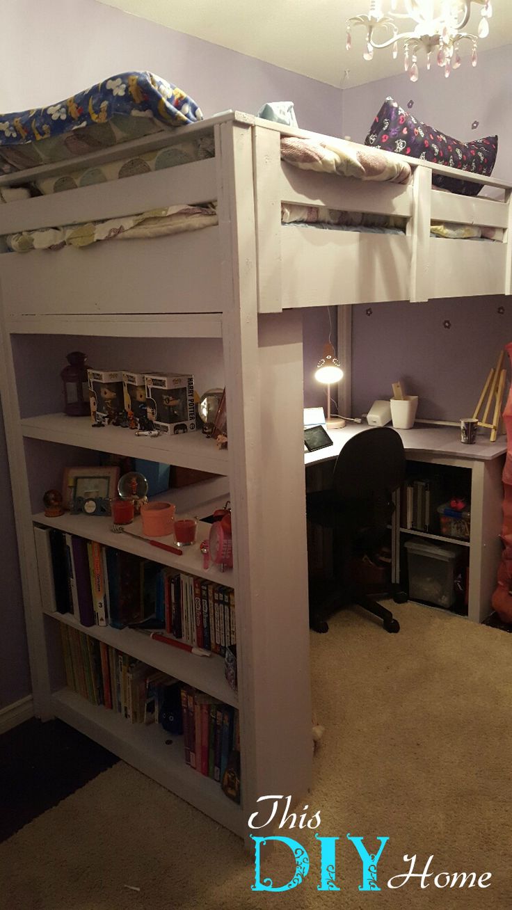 there is a bunk bed with a desk and bookshelf in the room that has a chandelier above it