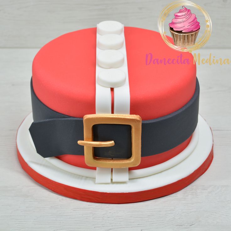 a red and white cake sitting on top of a plate