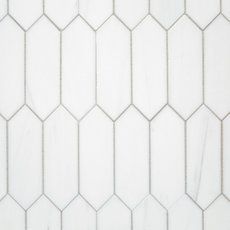 a white tiled wall with hexagonal shapes