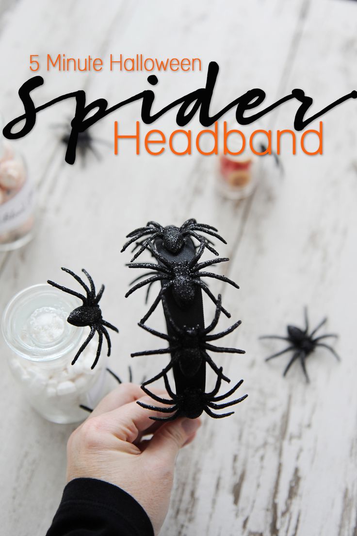 a hand is holding a fake spider head and it's spooked out