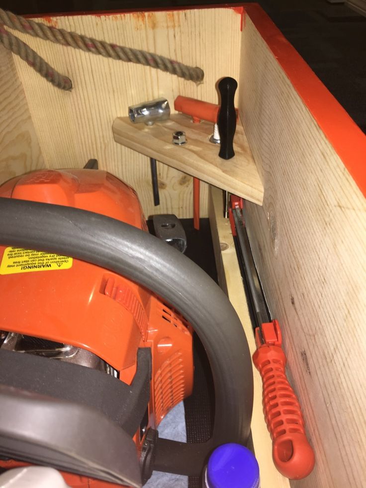 an orange and black machine sitting on top of a wooden table