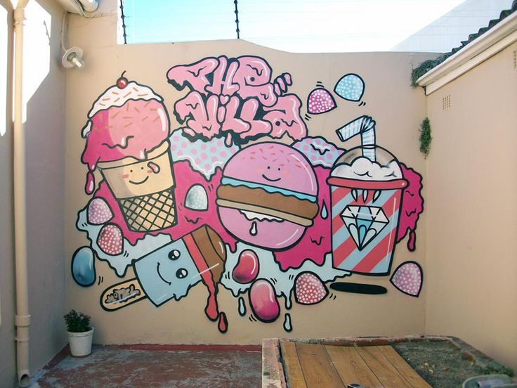 a mural on the side of a building with ice cream, donuts and other items